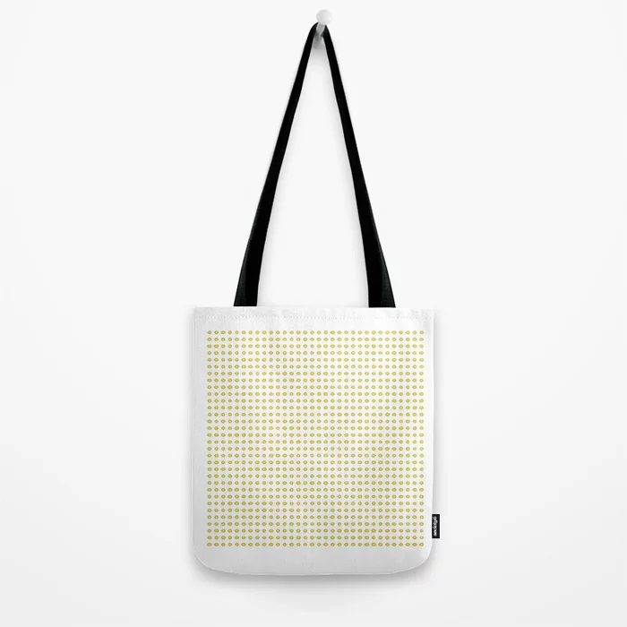 A product photo of a cotton totebag, filled with illustrations of 1024 yellow lemons.