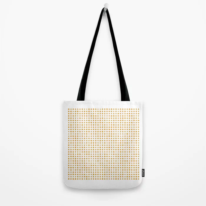 A product photo of a cotton totebag, filled with illustrations of 1024 yellow oranges.